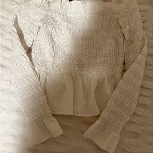 Divided Cream Smocked Peplum Blouse